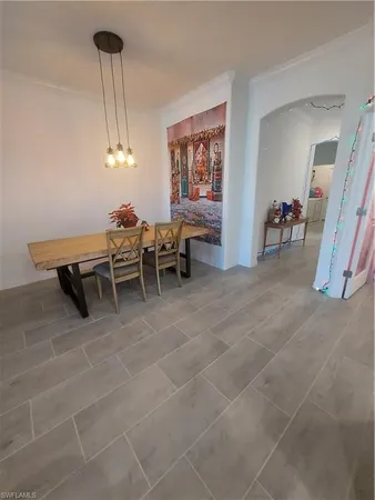 a view of a livingroom with furniture and a window