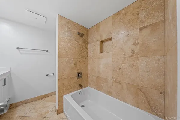 a bathroom with a bathtub and a shower