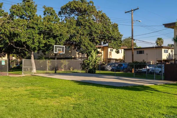 a house view with swimming pool in front of it