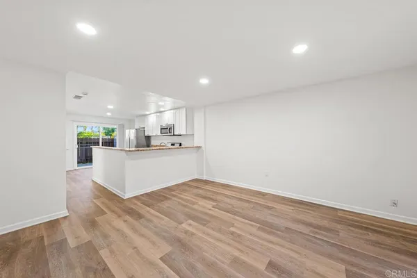 a view of kitchen with wooden floor