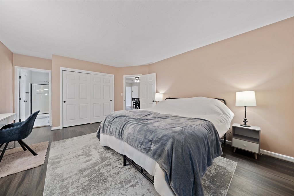 22 Union Square, Unit 22 Randolph, MA 02368 - Photo 18 of 28 a bedroom with a bed and a chair