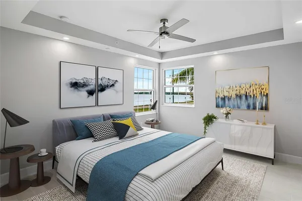 a bedroom with a balcony a bed and a chandelier