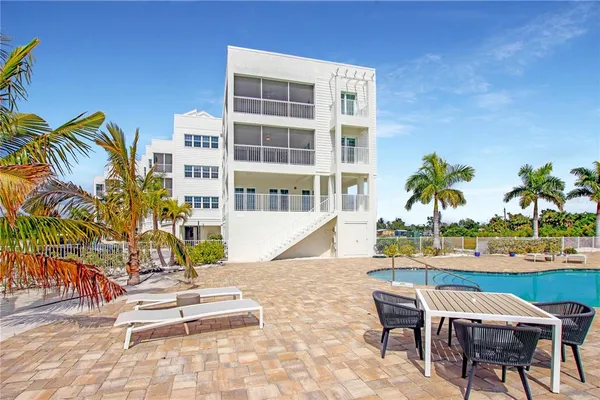 a view of a chairs and table in patio