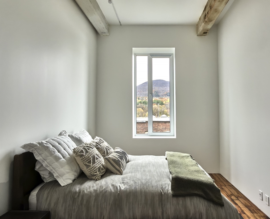 520 State Road, Unit 205 North Adams, MA 01247 - Photo 14 of 20 a bedroom with a bed and a window