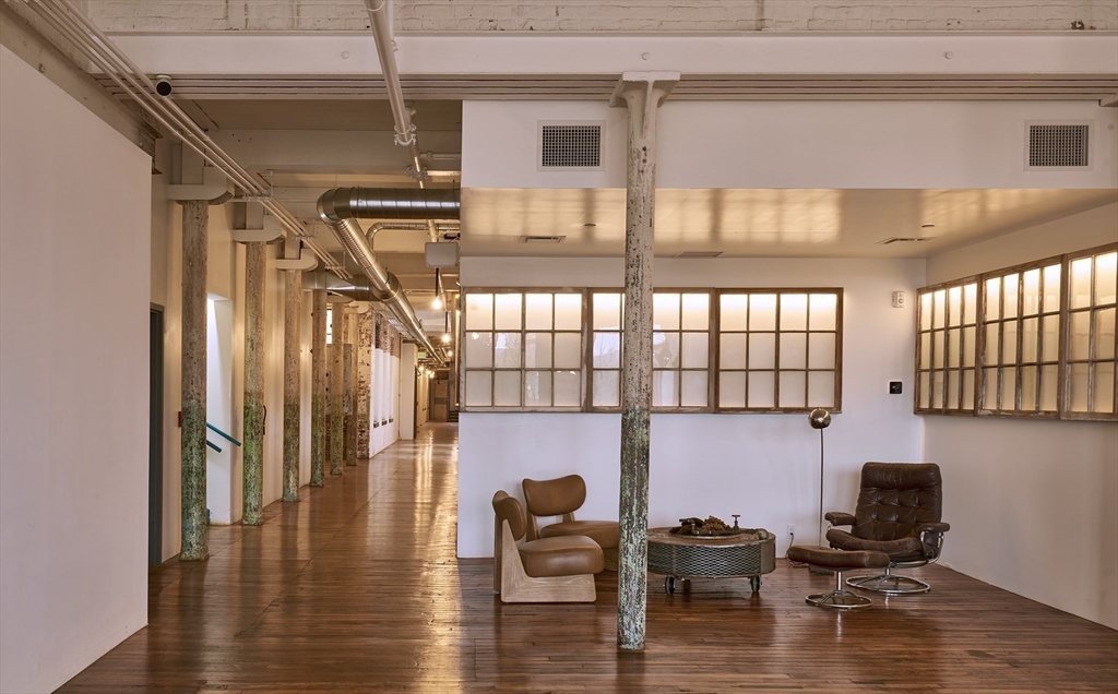 520 State Road, Unit 205 North Adams, MA 01247 - Photo 5 of 20 a hallway with wooden floor