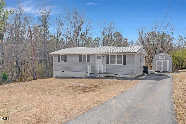 a house with trees in front of it
