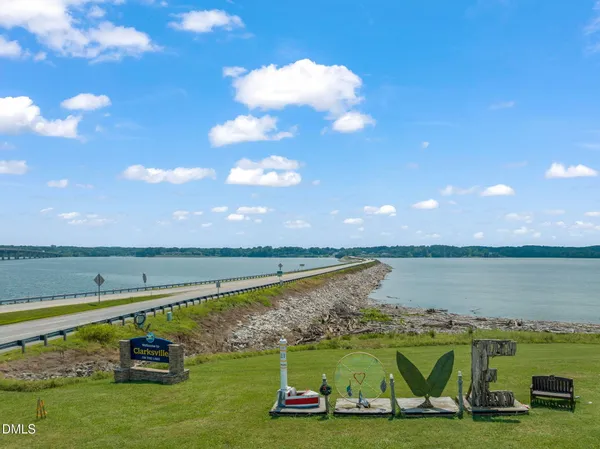 a view of a lake with a yard