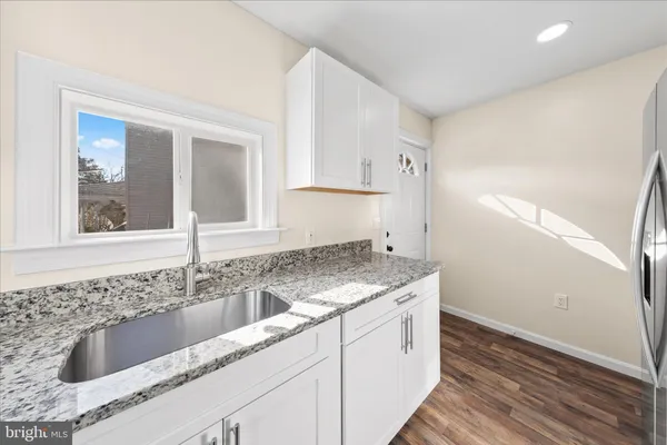 a kitchen with a stove and a microwave