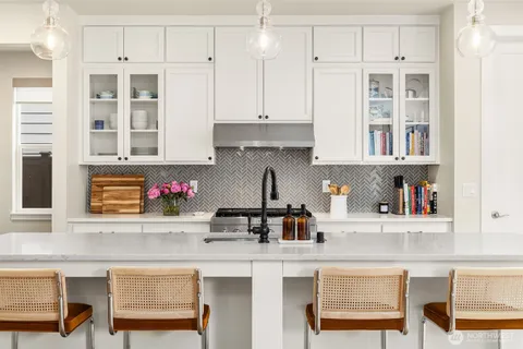 a kitchen with cabinets and window