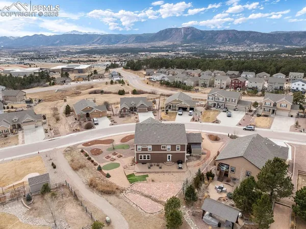 an aerial view of residential houses with outdoor space