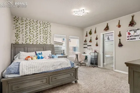 a bedroom with a bed and a window in it