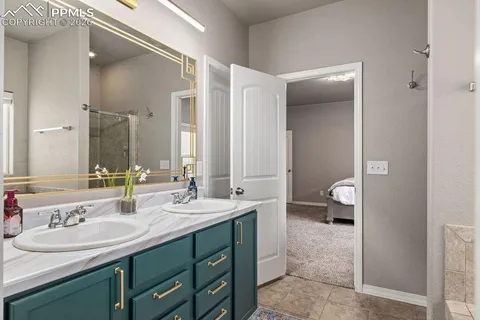 a bathroom with a sink double vanity and a mirror