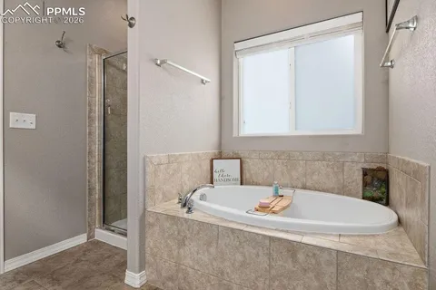 a bathroom with a tub and a sink