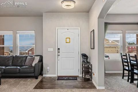 a living room with furniture and a rug