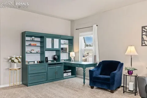 a living room with furniture and a window