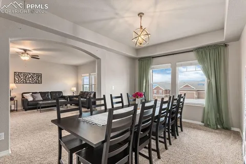 a view of a dining room with furniture window and outside view