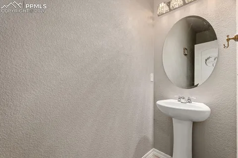 a bathroom with a sink and mirror