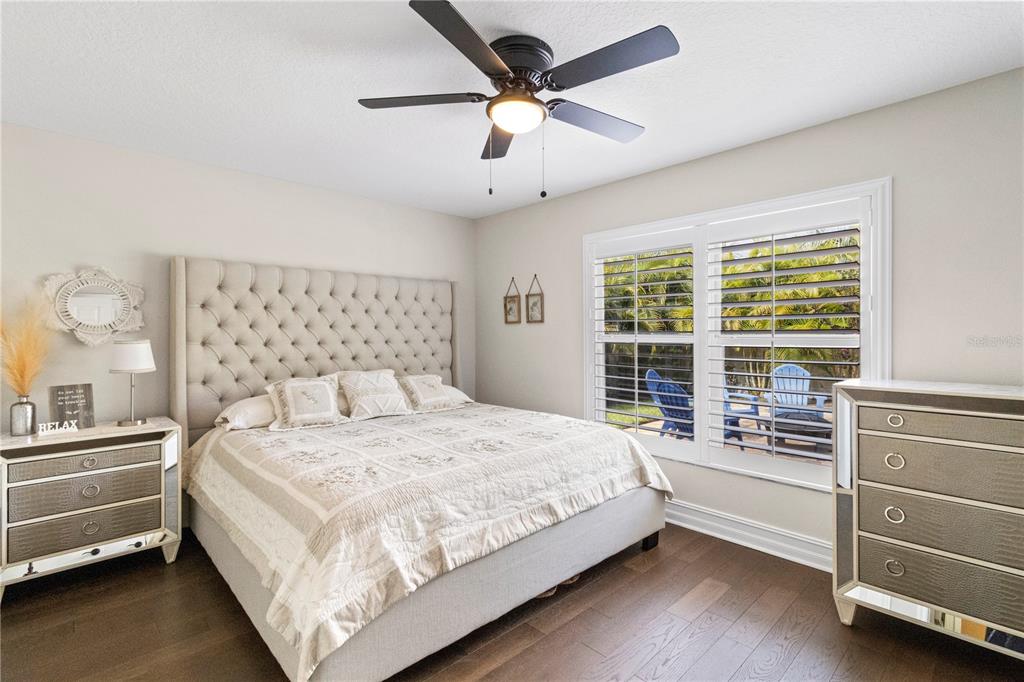 11208 Ledgement Lane Windermere, FL 34786 - Photo 23 of 36 a bedroom with a bed and a large window