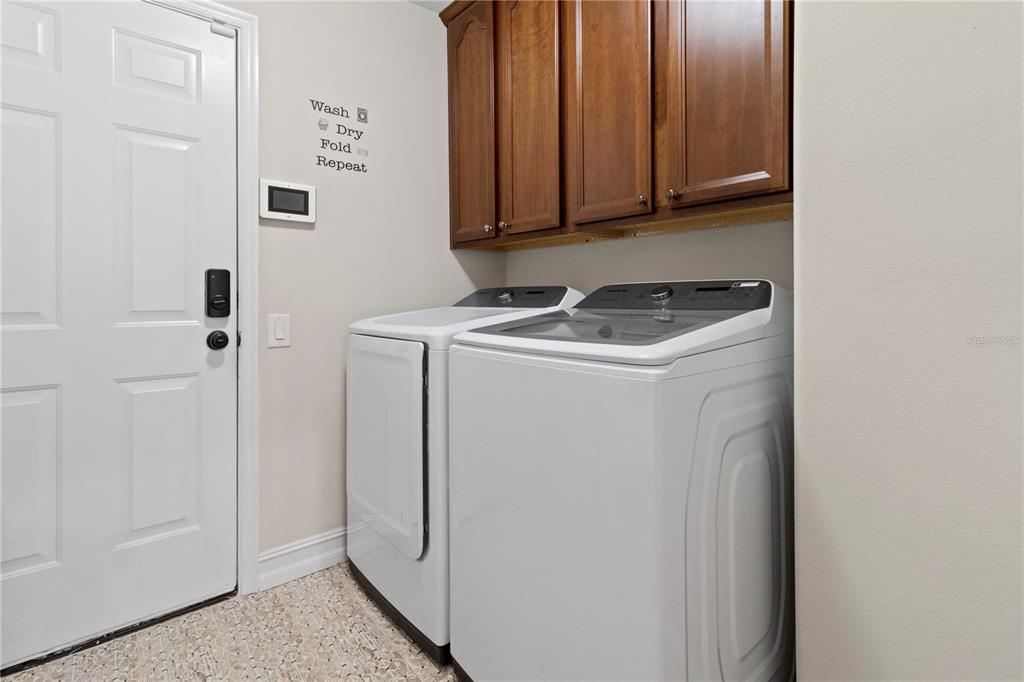 11208 Ledgement Lane Windermere, FL 34786 - Photo 30 of 36 a utility room with dryer and washer