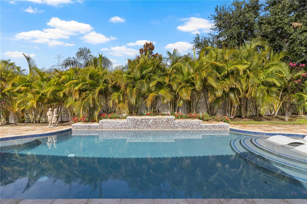 11208 Ledgement Lane Windermere, FL 34786 - Photo 35 of 36 a view of a swimming pool with an outdoor space and seating area