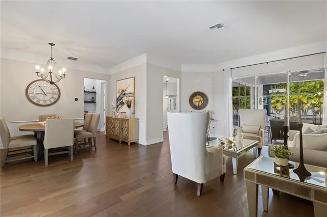a view of a livingroom with furniture window and wooden floor