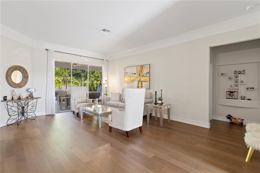 11208 Ledgement Lane Windermere, FL 34786 - Photo 8 of 36 a living room with furniture and wooden floor
