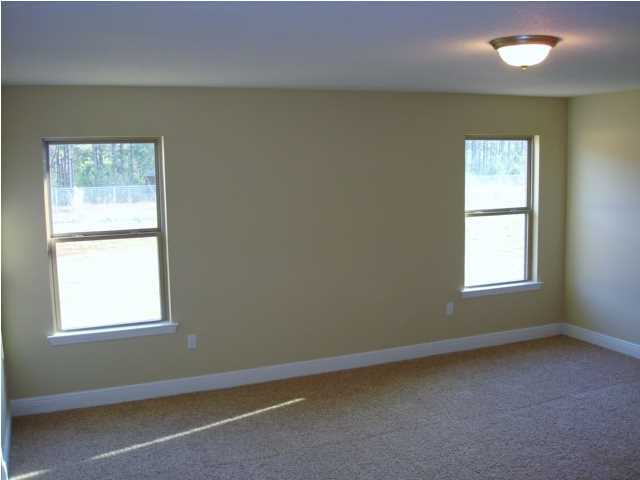 5608 Price Plantation Road Baker, FL 32531 - Photo 20 of 34 an empty room with a window