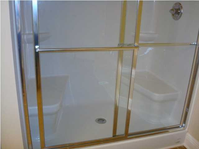 5608 Price Plantation Road Baker, FL 32531 - Photo 22 of 34 a bathroom with a glass shower door