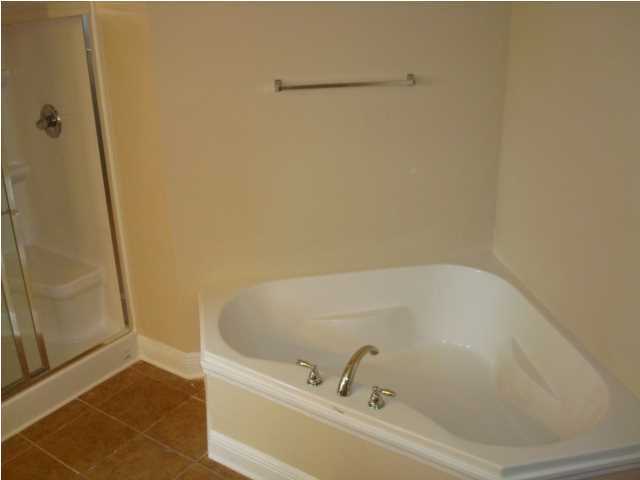 5608 Price Plantation Road Baker, FL 32531 - Photo 24 of 34 a bathroom with a bathtub