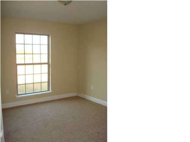 5608 Price Plantation Road Baker, FL 32531 - Photo 28 of 34 an empty room with windows