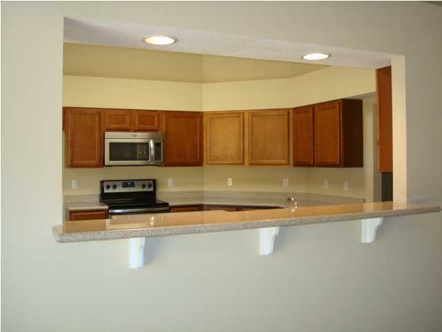 5608 Price Plantation Road Baker, FL 32531 - Photo 4 of 34 a view of kitchen with microwave and cabinets