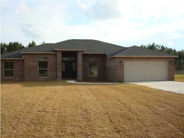 5608 Price Plantation Road Baker, FL 32531 - Photo 33 of 34 front view of a house with a yard