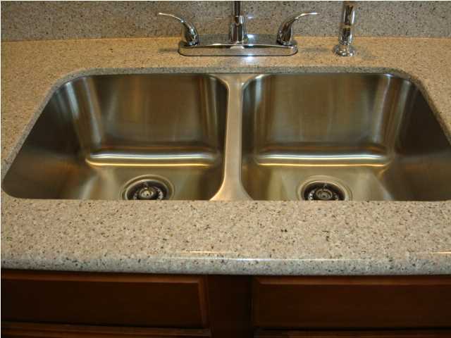 5608 Price Plantation Road Baker, FL 32531 - Photo 6 of 34 a bathroom with a granite countertop sink