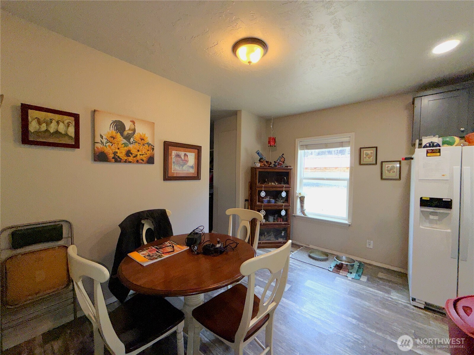 116 Cape Labelle Road Wauconda, WA 98859 - Photo 4 of 35 a view of a dining room with furniture window and wooden floor