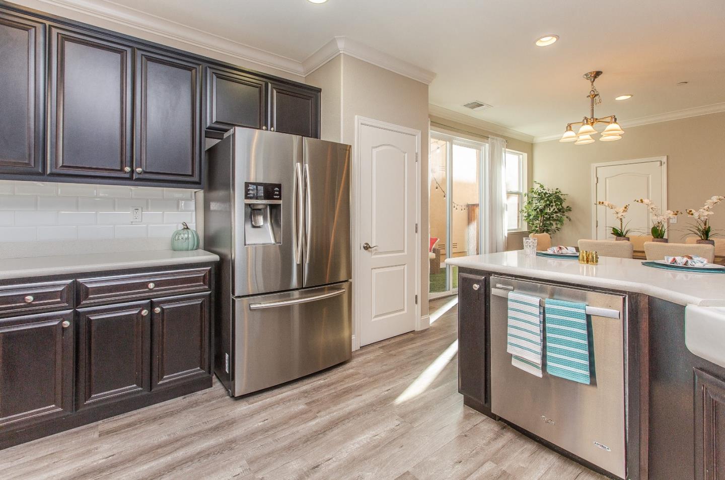 104 Caspian Way Gilroy, CA 95020 - Photo 13 of 33 a kitchen with kitchen island a sink appliances and cabinets