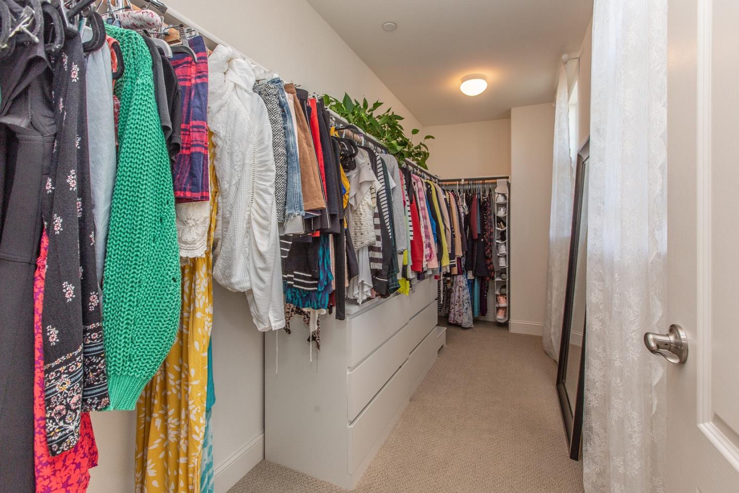 104 Caspian Way Gilroy, CA 95020 - Photo 19 of 33 a view of walk in closet with clothes