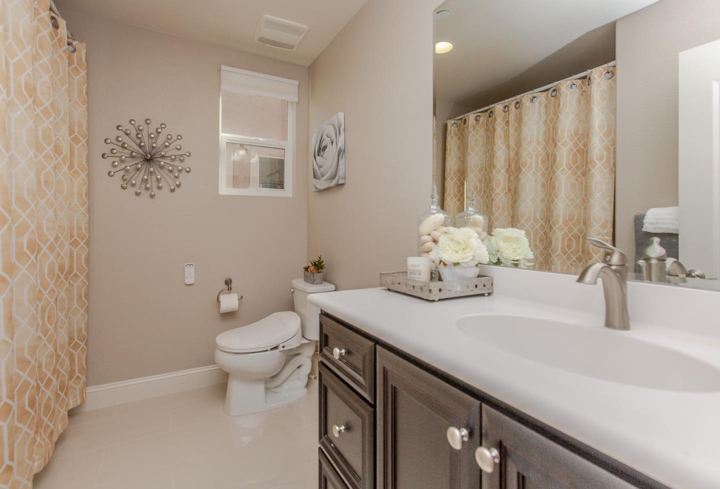 104 Caspian Way Gilroy, CA 95020 - Photo 21 of 33 a bathroom with a sink and a toilet