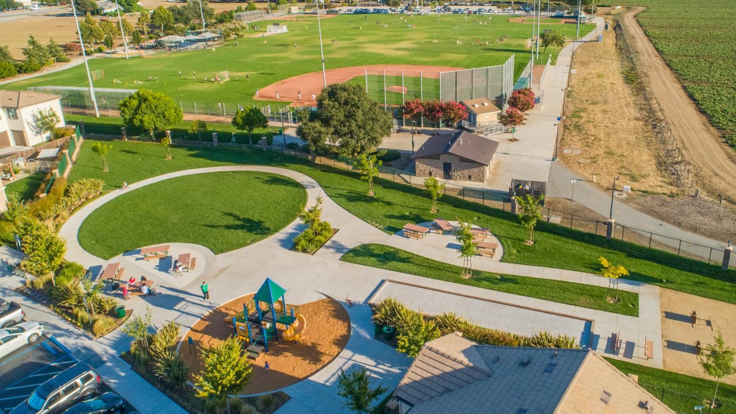 104 Caspian Way Gilroy, CA 95020 - Photo 31 of 33 an aerial view of a house with a garden and lake view