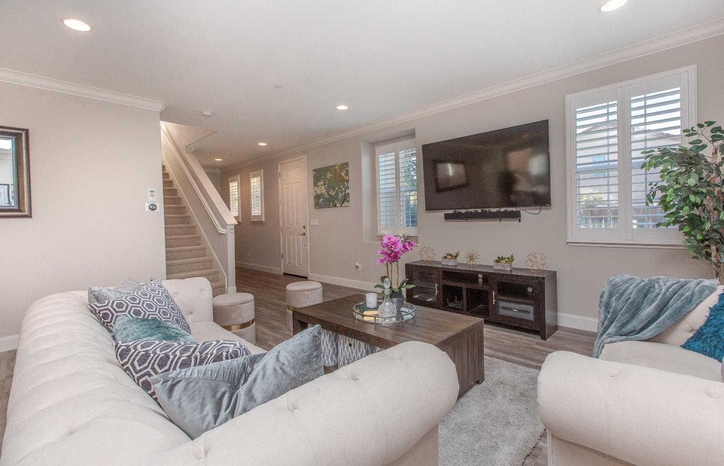 104 Caspian Way Gilroy, CA 95020 - Photo 5 of 33 a living room with furniture and a flat screen tv