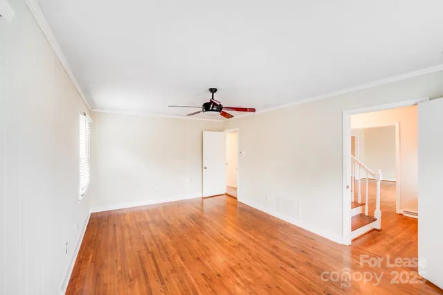 a kitchen with a refrigerator sink and cabinets