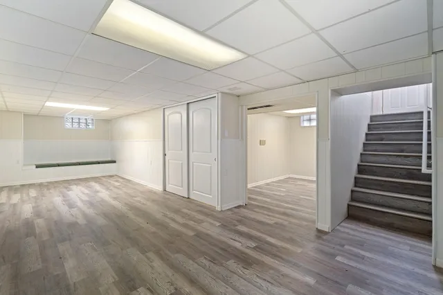 a view of wooden floor and windows in a room