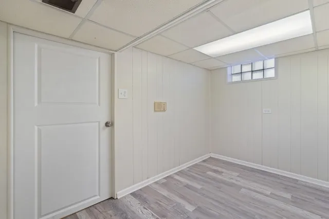 a view of room with window and hardwood floor