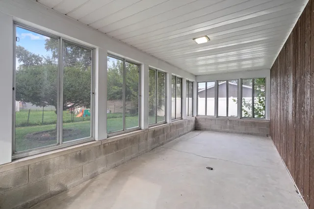 a view of an empty room with windows
