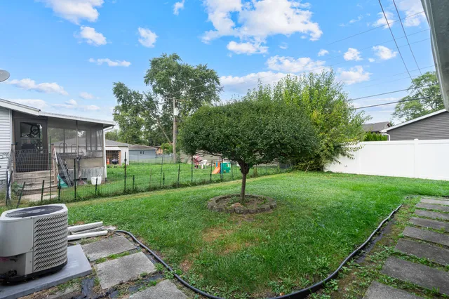 a backyard of a house with lots of green space