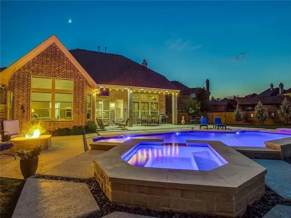 a view of swimming pool with outdoor seating