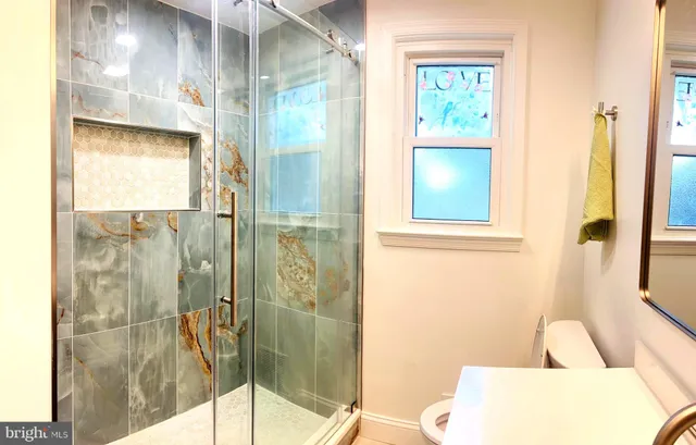 a bathroom with a bathtub and a shower