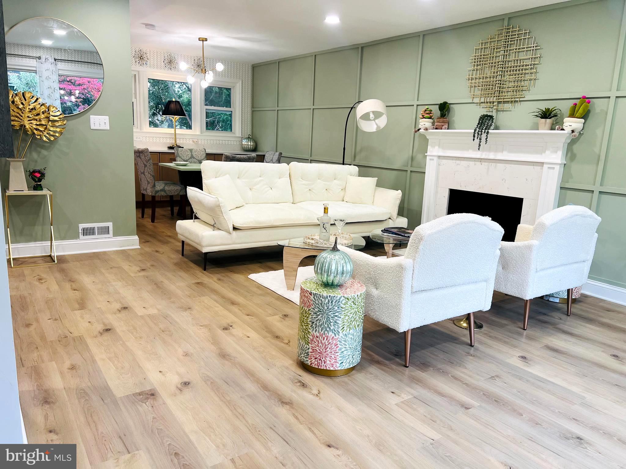 8802 2nd Avenue Silver Spring, MD 20910 - Photo 2 of 60 a living room with furniture and a fireplace