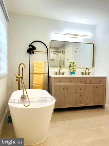 a bathroom with a tub and a shower