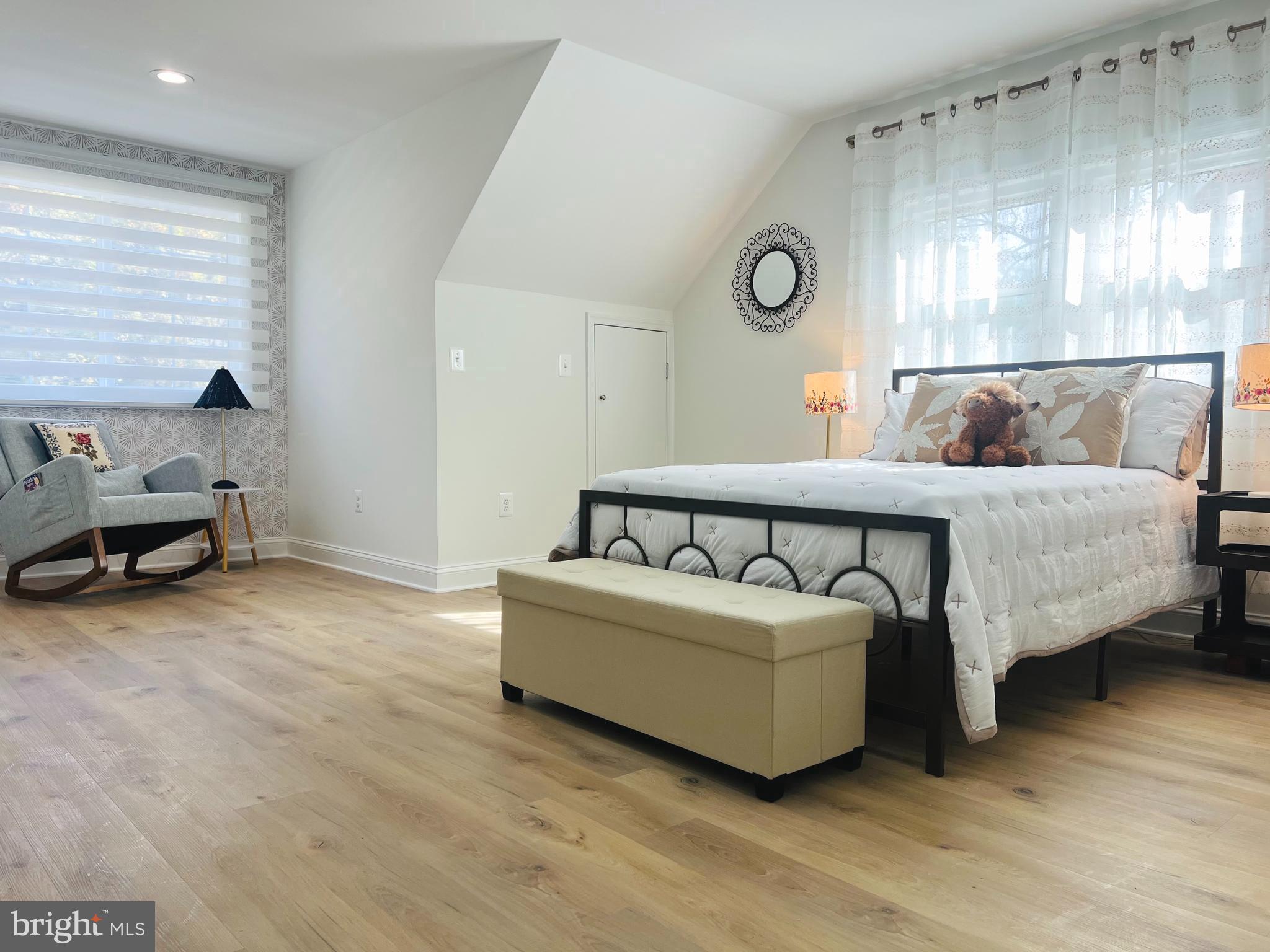 8802 2nd Avenue Silver Spring, MD 20910 - Photo 32 of 60 a spacious bedroom with a bed and a window