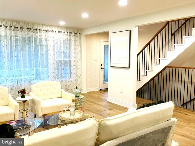 a living room with furniture and a table